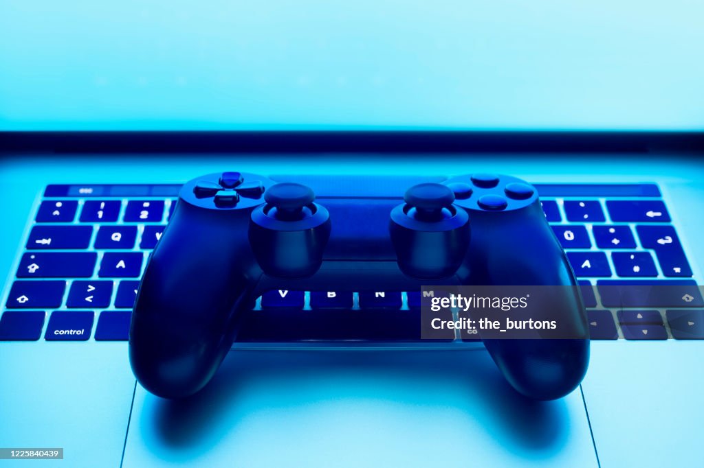 Still Life Of Game Controller On Laptop Symbol For Playing Online Games  High-Res Stock Photo - Getty Images