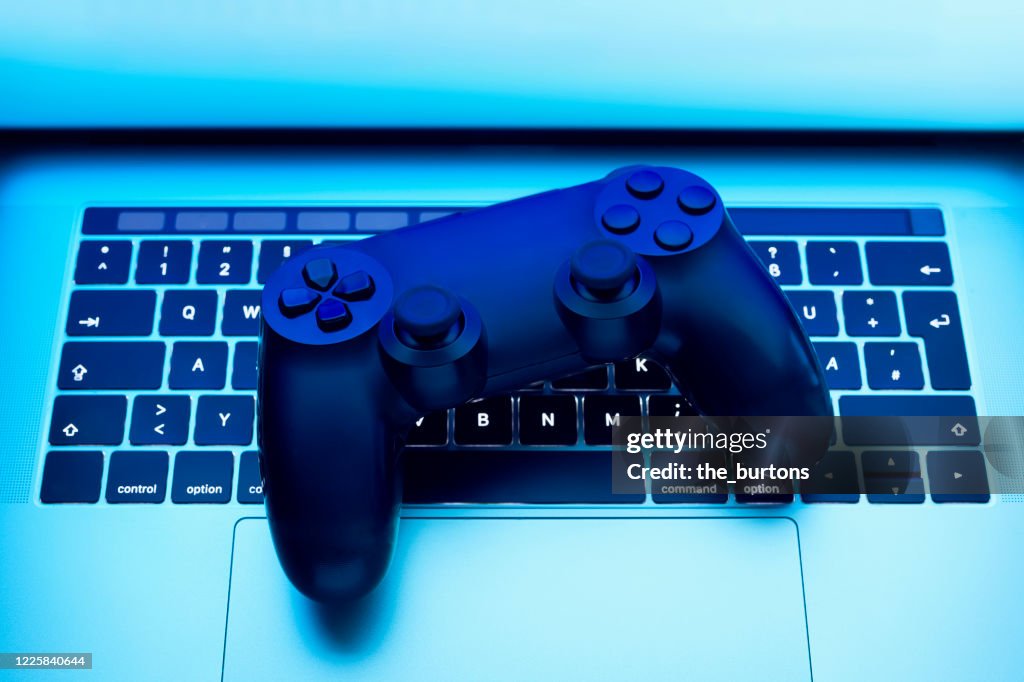 High angle view of game controller on laptop