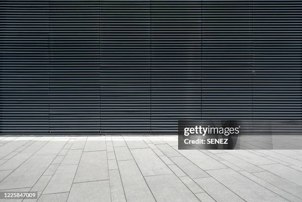 empty futuristic architecture with gray floors and silver metal line wall - metal grate fotografías e imágenes de stock