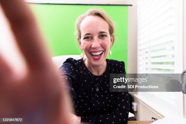 confident female influencer - hand covering camera stock pictures, royalty-free photos & images