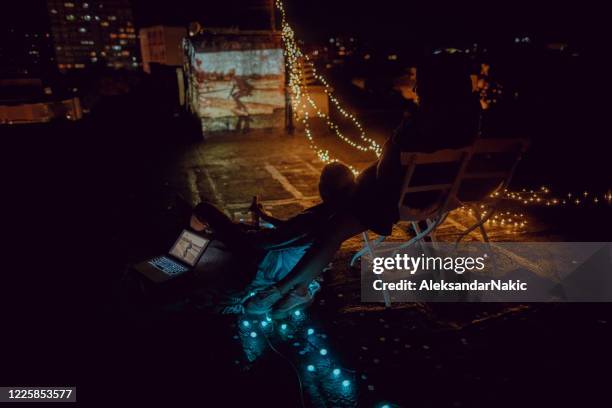 rooftop movie nights with my girlfriends - night in stock pictures, royalty-free photos & images
