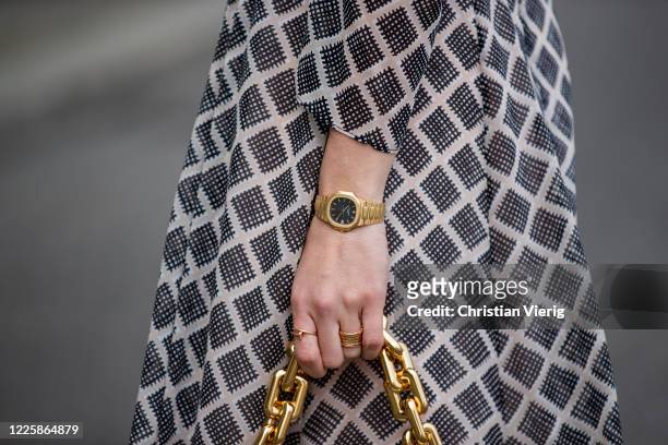Sonia Lyson is seen wearing grey checkered dress Hofmann Copenhagen, watch Patek Philippe Nautilus in gold on May 19, 2020 in Berlin, Germany.
