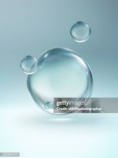 close up of four floating clear water droplet - wet see through fotografías e imágenes de stock