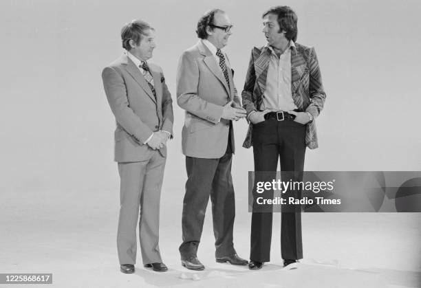 Comedians Eric Morecambe and Ernie Wise with presenter Des O'Connor on the Christmas special of the BBC television series 'The Morecambe and Wise...