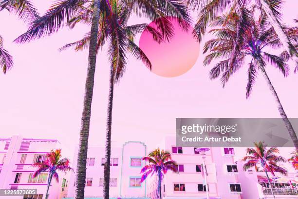 dreamy picture of miami ocean drive waterfront with neon colors and big sun. - city of miami fotografías e imágenes de stock