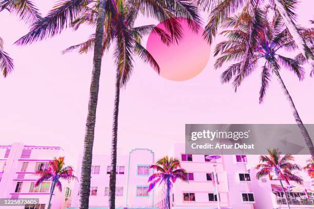 dreamy picture of miami ocean drive waterfront with neon colors and big sun. - psychedelic trip stock pictures, royalty-free photos & images