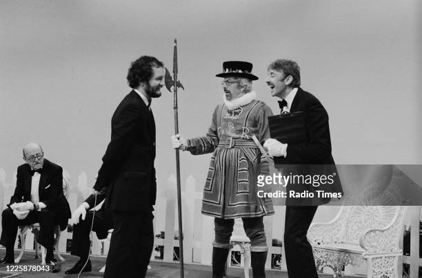 Comedians Kenny Everett and Barry Cryer filming a sketch for the BBC television series 'The Kenny Everett Television Show', March 17th 1982.