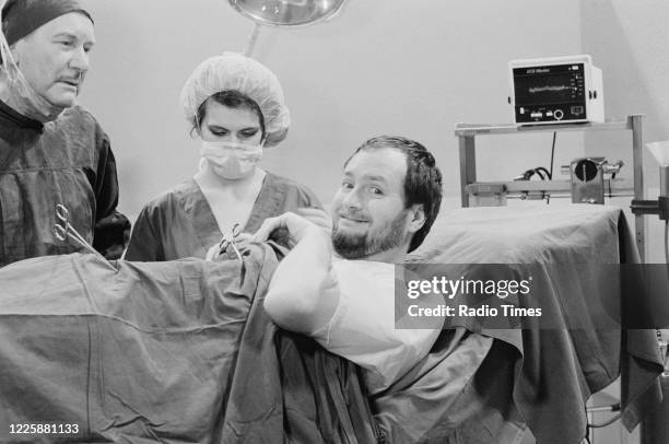 Comedian Kenny Everett and actress Cleo Rocos filming a sketch for the BBC television series 'The Kenny Everett Television Show', January 27th 1983.