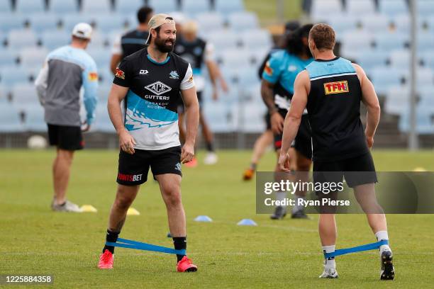 Aaron Woods of the Sharks stretches during a Cronulla Sharks NRL training session at PointsBet Stadium on May 20, 2020 in Sydney, Australia.