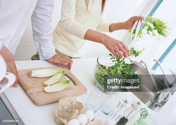 a couple in kitchen - chicory stock pictures, royalty-free photos & images