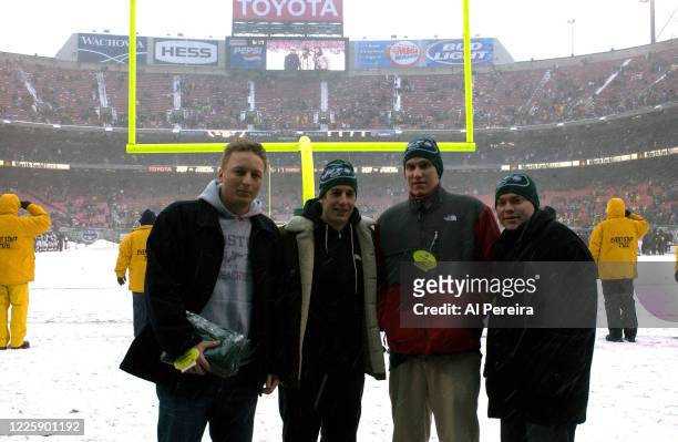Actor Jason Biggs and his guests attend the New York Jets vs Pittsburgh Steelers game in a heavy snowstorm at The Meadowlands on in East Rutherford,...