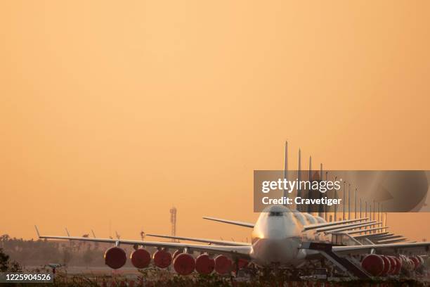 so many airplanes are in line on the runway waiting for take off.these air force planes are part of operation stop service to transport in covid-19 situation. - taxiing stock pictures, royalty-free photos & images