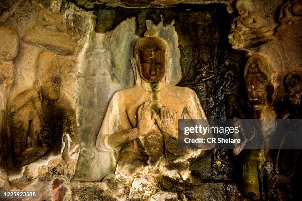 buddha statue inside of pandav leni the buddha caves at nashik, maharashtra, india. - nasik caves stock pictures, royalty-free photos & images