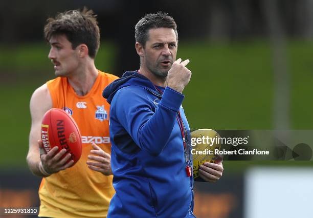 Kangaroos assistant coach, Jade Rawlings gestures during a North Melbourne Kangaroos AFL media opportunity at Arden Street Ground on May 20, 2020 in...
