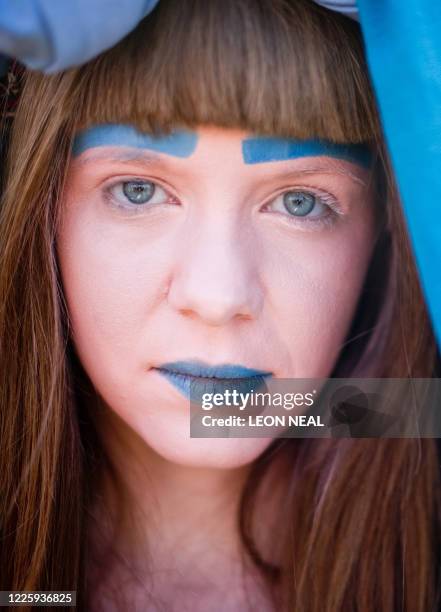 Members of the alternative choir "Gaggle" prepare to take part in a 'Join Me On The Bridge' event on the Millennium Bridge in central London, on...