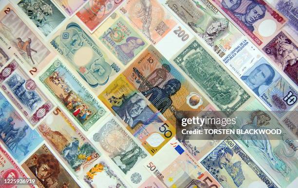 Australian 10 and 50 dollar polymer notes are surrounded by a mosaic of international currencies as the Reserve Bank of Australia leaves the official...