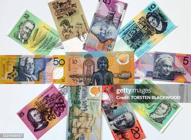 Australian dollar paper and polymer notes form a colourful mosaic as the Reserve Bank of Australia leaves the official cash rate unchanged at 3.25...