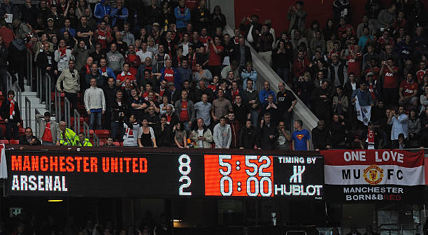 The scoreboard displays the 8-2 score-line during the English Premier League football match between Manchester United and Arsenal at Old Trafford in...