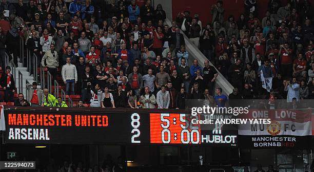 The scoreboard displays the 8-2 score-line during the English Premier League football match between Manchester United and Arsenal at Old Trafford in...