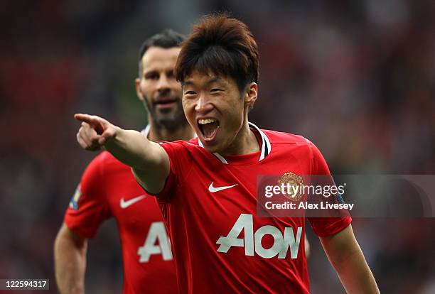 Ji-Sung Park of Manchester United celebrates with Ashley Young after scoring his goal during the Barclays Premier League match between Manchester...