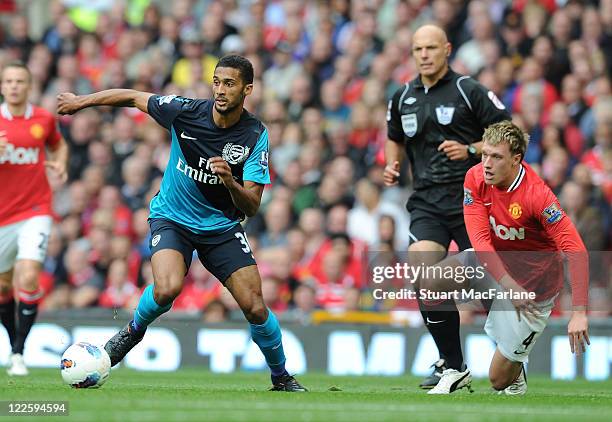 Armand Traore of Arsenal takes on Phil Jones of Manchester Unired during the Barclays Premier League match between Manchester United and Arsenal at...