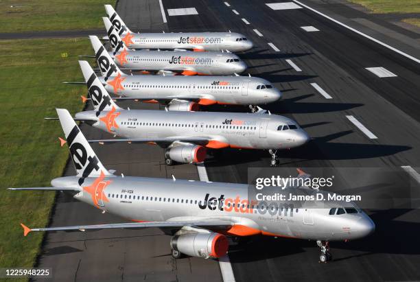 Jetstar aircraft parked on the east-west runway at Sydney's International airport on May 20, 2020 in Sydney, Australia. Sydney Airport has...