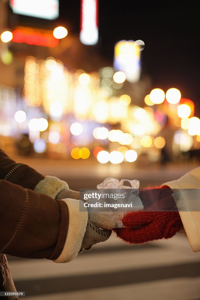 Couple holding a present