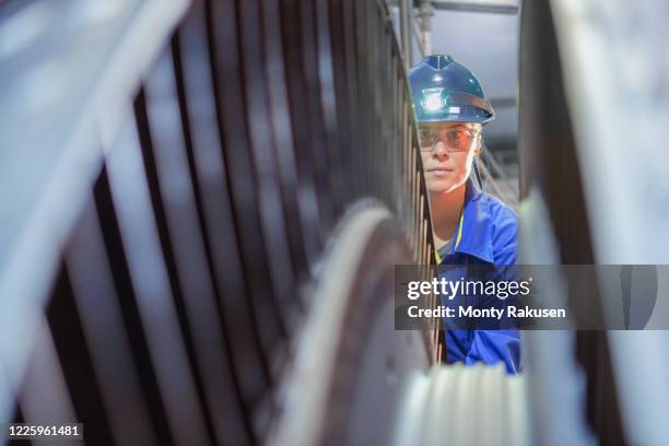 female engineer inspecting a turbine in a  nuclear power station. - nuclear power station stock-fotos und bilder