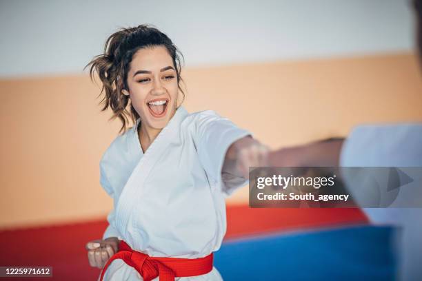 one female karate student on karate training - karate imagens e fotografias de stock