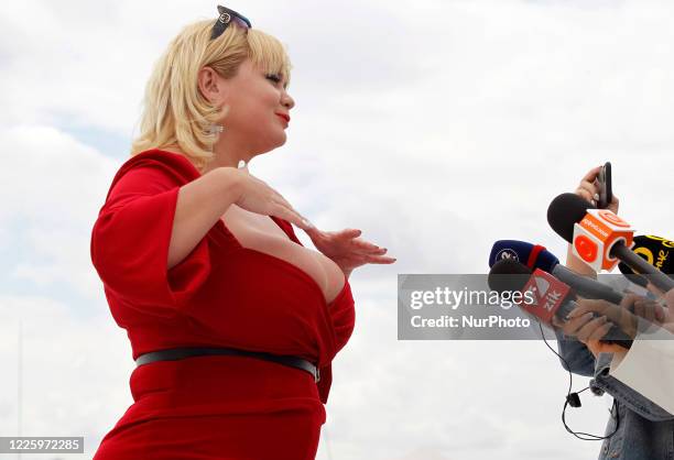 The winner Mila Kuznetsova with 13th breast size speaks with media during the Ukrainian record in a nomination 'The largest female natural breasts'...