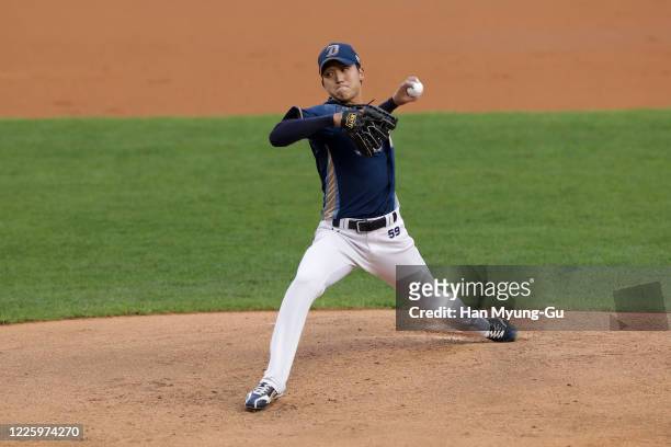 Pitcher Koo Chang-Mo of NC Dinos throws in the bottom of the first inning during the KBO League game between NC Dinos and Doosan Bears at the Jamsil...