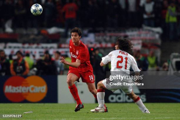 Xabi Alonso of Liverpool and Andrea Pirlo of AC Milan compete for the ball during the UEFA Champions League final between AC Milan and Liverpool at...