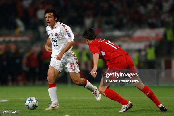 Andrea Pirlo of AC Milan and Vladimír Smicer of Liverpool compete for the ball during the UEFA Champions League final between AC Milan and Liverpool...