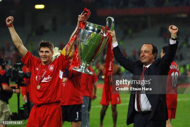 Captain Steven Gerrard and manager Rafael Benitez of Liverpool lift the trophy after the ceremony following the UEFA Champions League final between...