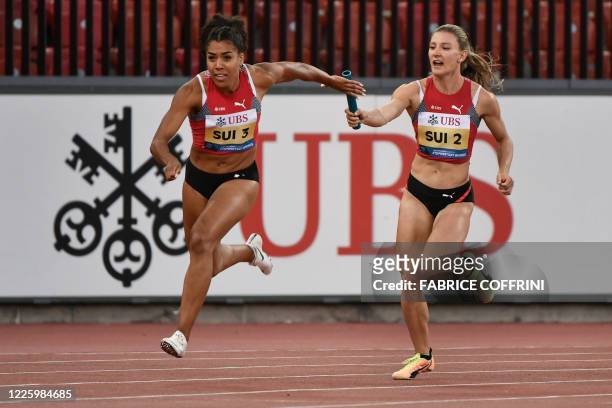 Switzerland's sprinters Mujinga Kambundji and Ajla Del Ponte compete in the women's 3x100m relay during the Inspiration Games exhibition event, being...