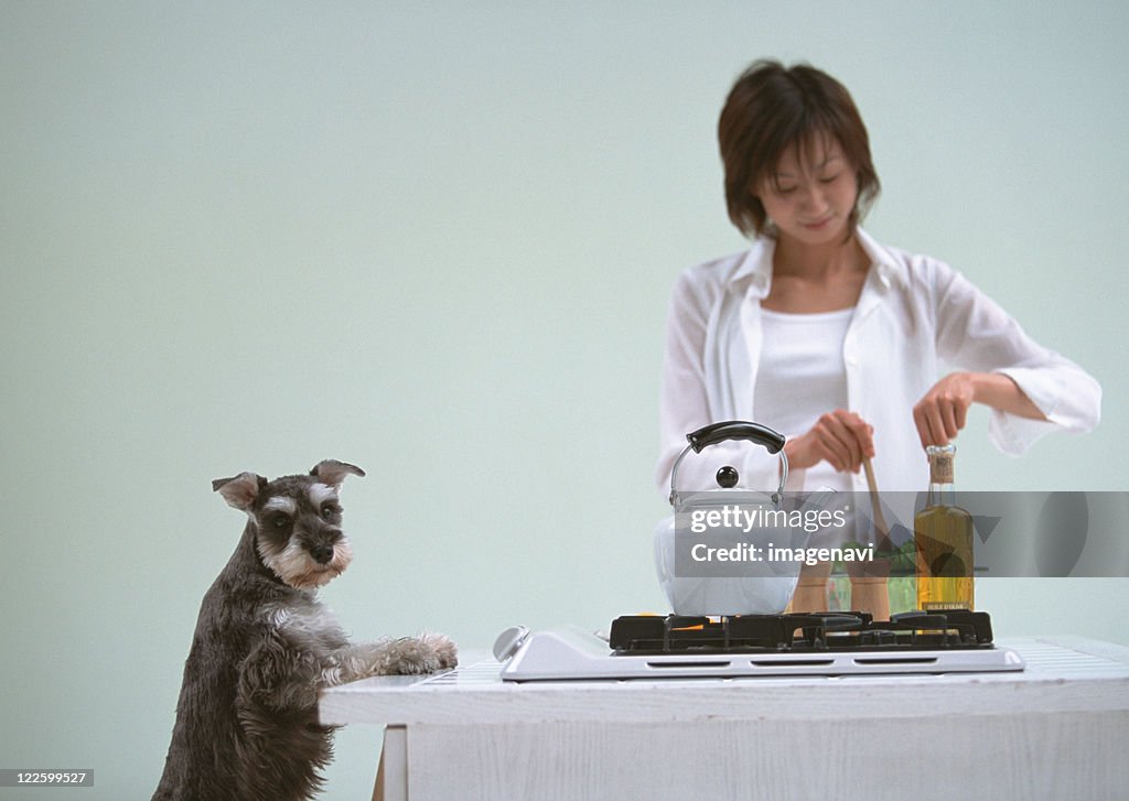 Cooking in kitchen with dog