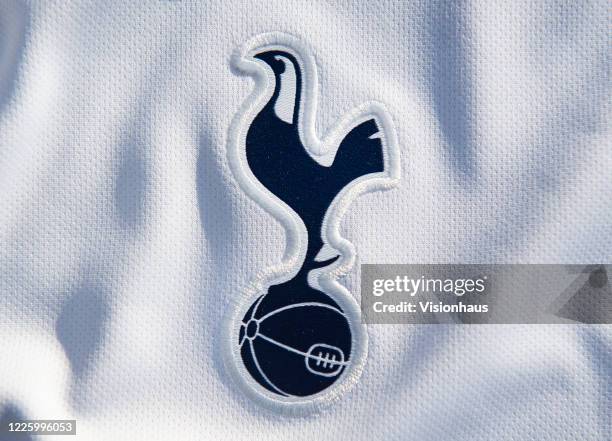 The Tottenham Hotspur club crest on their first team home shirt on May 13, 2020 in Manchester, England.