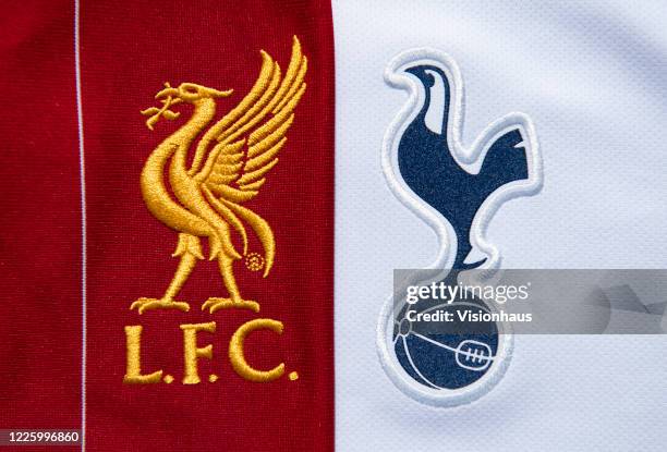 The Liverpool and Tottenham Hotspur club crests on their first team home shirts on May 13, 2020 in Manchester, England.