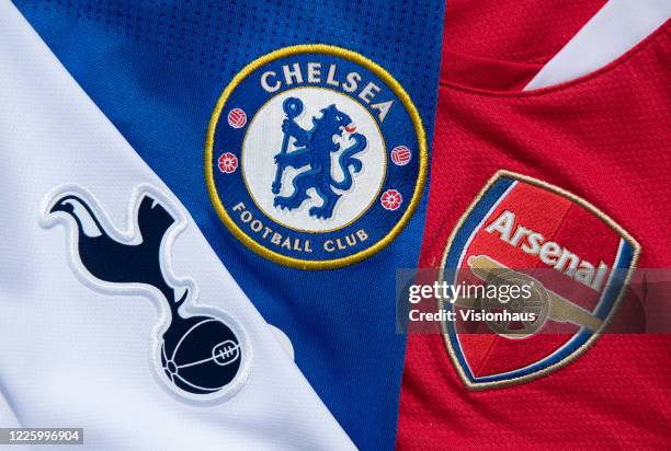 The Chelsea, Arsenal and Tottenham Hotspur club badges on their first team home shirts on May 13, 2020 in Manchester, England.