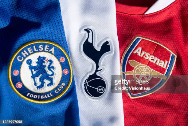 The Chelsea, Arsenal and Tottenham Hotspur club badges on their first team home shirts on May 13, 2020 in Manchester, England.