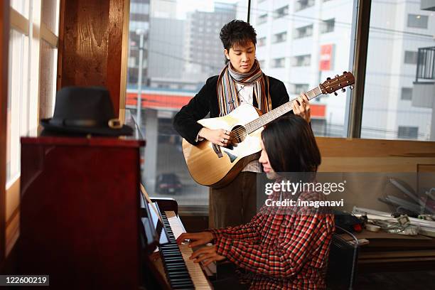 young people playing instruments - players association stock pictures, royalty-free photos & images