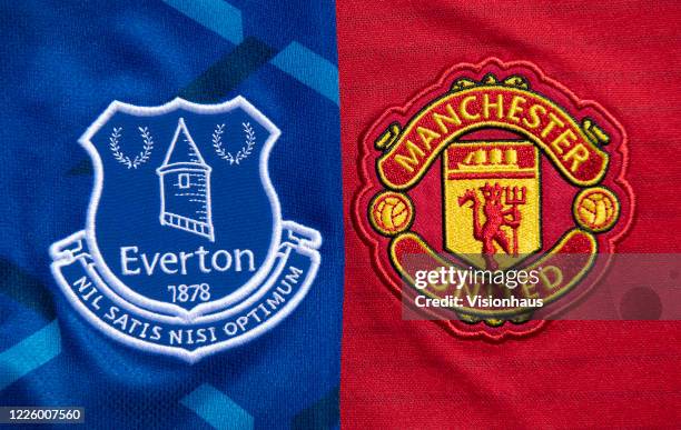 The Everton and Manchester United club crests on their first team home shirts on May 14, 2020 in Manchester, England.