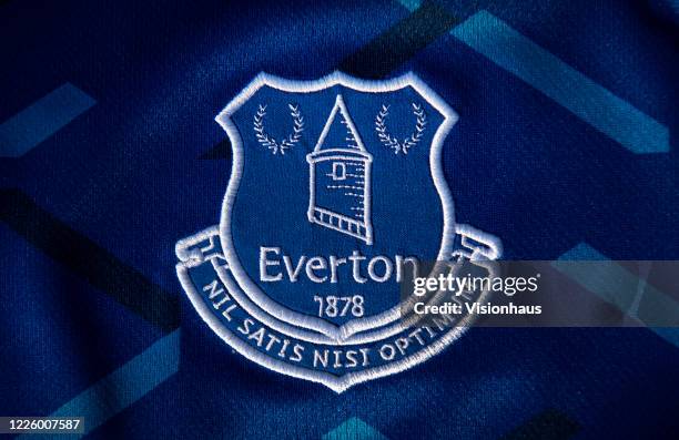 The Everton club crest on their first team home shirt on May 14, 2020 in Manchester, England.