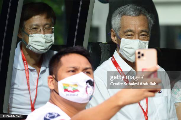 Supporter takes a selfie with People's Action Party Secretary-General and Singapore Prime Minister, Lee Hsien Loong and running candidate for Ang Mo...