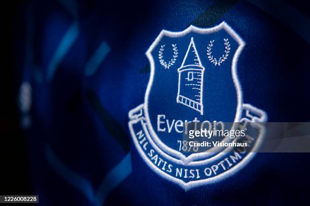 The Everton club crest on their first team home shirt on May 14, 2020 in Manchester, England.