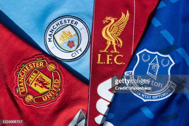 The club crests of the Premier League clubs Everton, Liverpool, Manchester City and Manchester United club crest on their first team home shirst on...