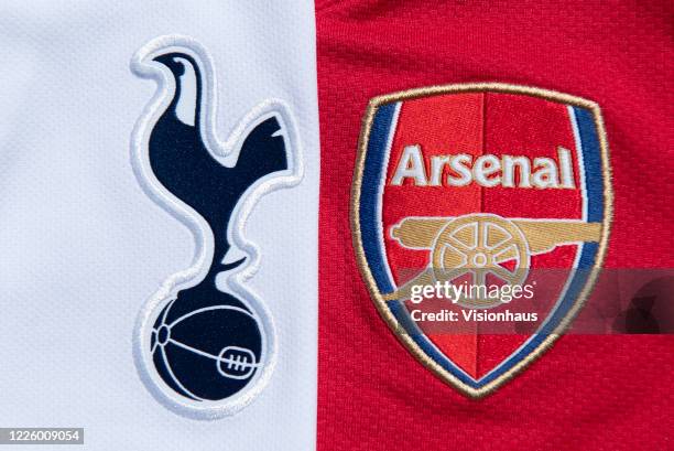 The Tottenham Hotspur and Arsenal club crests on their first team home shirts on May 14, 2020 in Manchester, England.