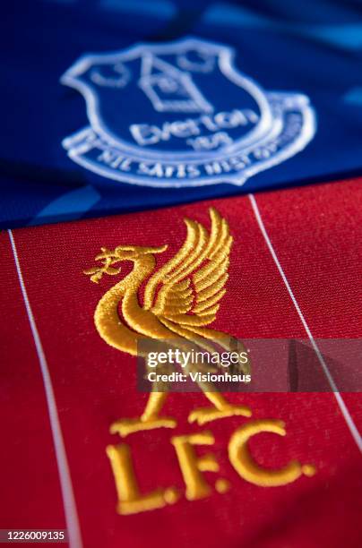 The Everton and Liverpool club crests on their first team home shirt son May 14, 2020 in Manchester, England.