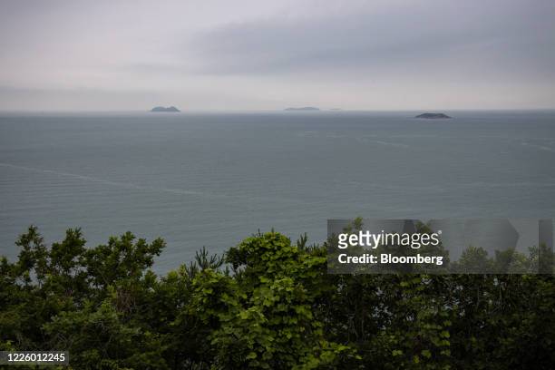 Islands belonging to North Korea are seen from the Manghyang observation deck on Yeonpyeong Island, South Korea, on Saturday, June 27, 2020. On the...