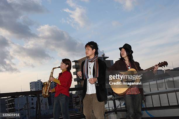 young people playing instruments - band merchandise stock pictures, royalty-free photos & images